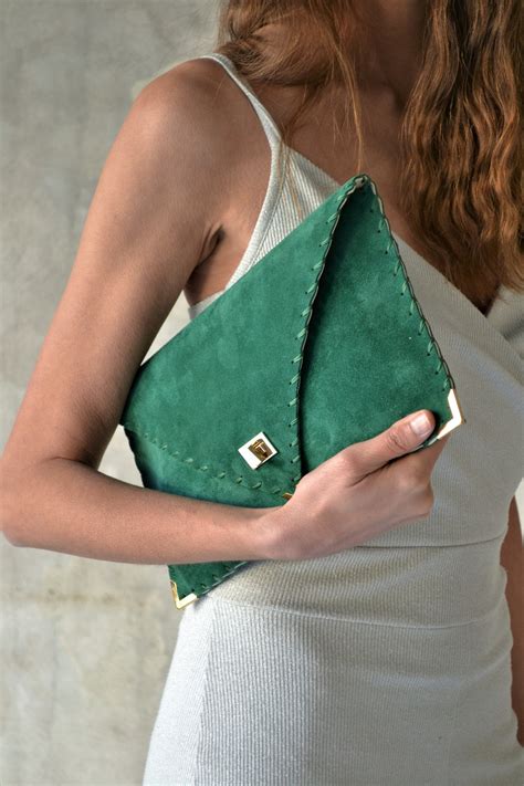 emerald green suede clutch bag.